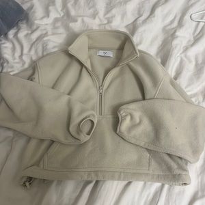 Two TNA half zips sweaters